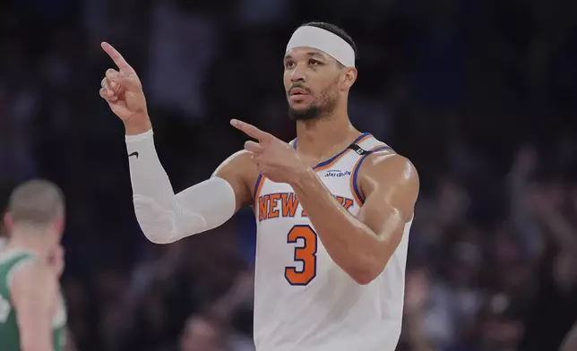 New York Knicks' Josh Hart (3) gestures after Boston Celtics' Jaylen Brown (7) fouls out during the second half of Game 6 in the Eastern Conference semifinals of the NBA basketball playoffs Friday, May 16, 2025, in New York. (AP Photo/Frank Franklin II)