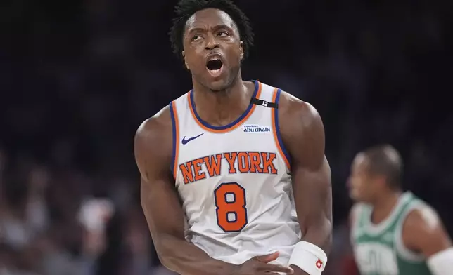 New York Knicks' OG Anunoby (8) celebrates after making a three-point shot during the second half of Game 6 in the Eastern Conference semifinals of the NBA basketball playoffs against the Boston Celtics Friday, May 16, 2025, in New York. (AP Photo/Frank Franklin II)