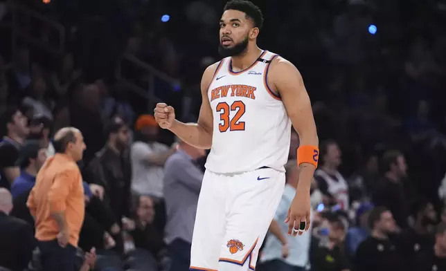 New York Knicks' Karl-Anthony Towns (32) celebrates during the second half of Game 6 in the Eastern Conference semifinals of the NBA basketball playoffs against the Boston Celtics Friday, May 16, 2025, in New York. (AP Photo/Frank Franklin II)