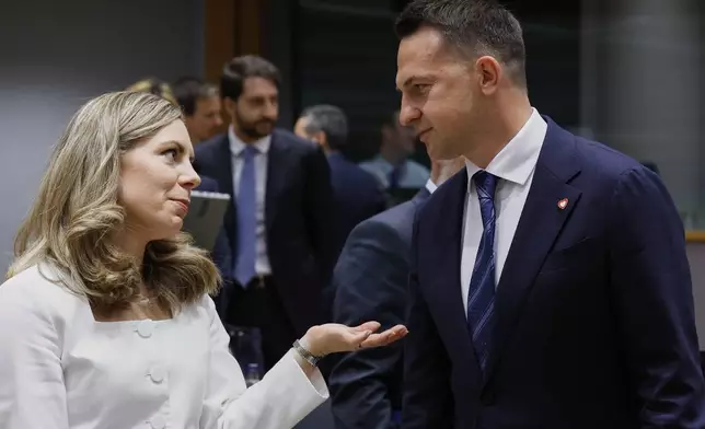 Polish Minister for the European Union Adam Szlapka, right, speaks with Sweden's Minister for European Union Affairs Jessica Rosencrantz during a meeting of the general affairs ministers at the European Council building in Brussels, Tuesday, May 27, 2025. (AP Photo/Omar Havana)