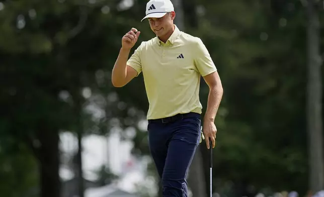 Ludvig Åberg, of Sweden, waves after making a putt on the ninth hole during the first round of the PGA Championship golf tournament at the Quail Hollow Club, Thursday, May 15, 2025, in Charlotte, N.C. (AP Photo/George Walker IV)