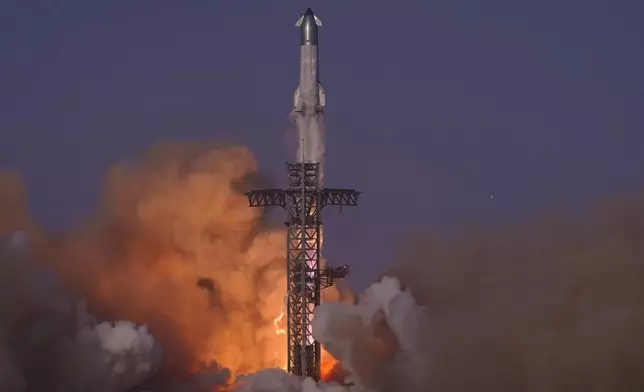 SpaceX's mega rocket Starship makes a test flight from Starbase, Texas, Tuesday, May 27, 2025. (AP Photo/Eric Gay)