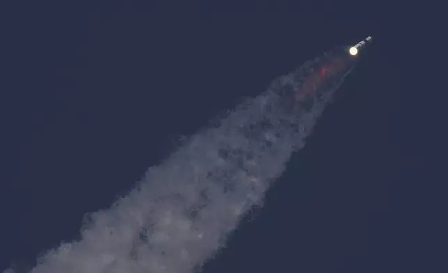 SpaceX's mega rocket Starship makes a test flight from Starbase, Texas, Tuesday, May 27, 2025. (AP Photo/Eric Gay)
