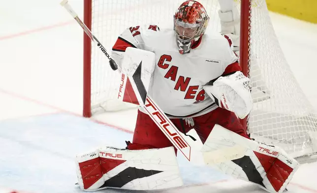 Carolina Hurricanes goaltender Frederik Andersen (31) stops the puck in the third period of Game 5 of a second-round NHL hockey playoff series against the Washington Capitals Thursday, May 15, 2025, in Washington. (AP Photo/Nick Wass)