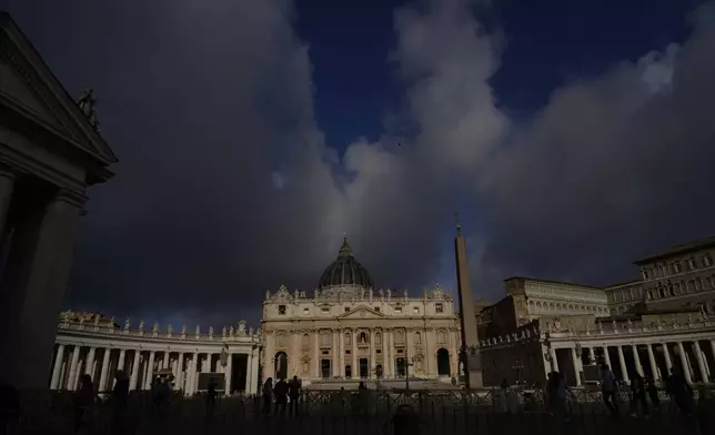 Clouds pass over the St. Peter Basilica at the Vatican, Tuesday, May 6, 2025. (AP Photo/Gregorio Borgia)