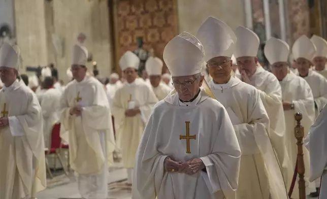 FILE - Cardinals leave at the end of a Mass on the eighth of nine days of mourning for Pope Francis, in St. Peter's Basilica, at the Vatican, Saturday, May 3, 2025. (AP Photo/Alessandra Tarantino, File)