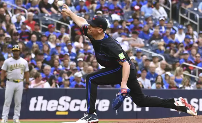 Toronto Blue Jays starting pitcher Chris Bassitt (40) throws to an Athletics batter in first inning MLB baseball action in Toronto on Friday, May 30, 2025. (Jon Blacker/The Canadian Press via AP)