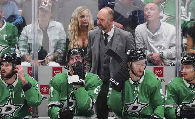 Dallas Stars head coach Pete DeBoer and the bench watch play against the Colorado Avalanche in the third period in Game 7 of a first-round NHL hockey playoff series Saturday, May 3, 2025, in Dallas. (AP Photo/Julio Cortez)