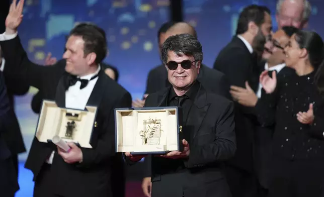 Director Jafar Panahi, accepts the Palme d'Or for the film 'It Was Just an Accident', during the awards ceremony of the 78th international film festival, Cannes, southern France, Saturday, May 24, 2025. (Photo by Lewis Joly/Invision/AP)
