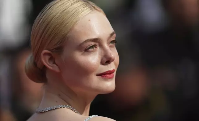 Elle Fanning poses for photographers during the awards ceremony red carpet at the 78th international film festival, Cannes, southern France, Saturday, May 24, 2025. (AP Photo/Natacha Pisarenko)