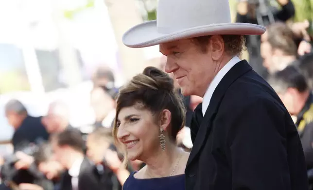 Alison Dickey, left, and John C. Reilly pose for photographers during the awards ceremony red carpet at the 78th international film festival, Cannes, southern France, Saturday, May 24, 2025. (Photo by Joel C Ryan/Invision/AP)
