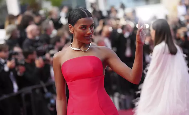 Simone Ashley poses for photographers during the awards ceremony red carpet at the 78th international film festival, Cannes, southern France, Saturday, May 24, 2025. (Photo by Lewis Joly/Invision/AP)