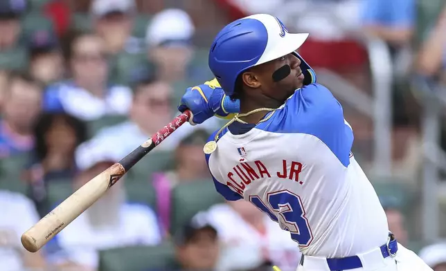 Atlanta Braves' Ronald Acuna Jr. hits a two-run home run in the sixth inning of a baseball game against the San Diego Padres, Saturday, May 24, 2025, in Atlanta. (AP Photo/Colin Hubbard)