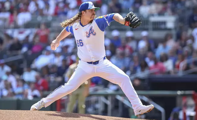 Atlanta Braves pitcher Grant Holmes (66) delivers in the first inning of a baseball game against the San Diego Padres, Saturday, May 24, 2025, in Atlanta. (AP Photo/Colin Hubbard)