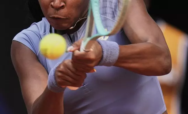 United States' Coco Gauff returns against Mirra Andreeva of Russia at the Madrid Open quarter-final tennis match in Madrid, Spain, Wednesday, April 30, 2025. (AP Photo/Manu Fernandez)