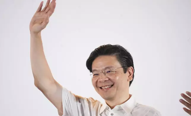 Prime Minister Lawrence Wong's, from People's Action Party (PAP) thanks his supporters and voters at an assembly area for People's Action Party supporters, on the day of the general election in Singapore, Saturday, May 3, 2025. (AP Photo/Vincent Thian)