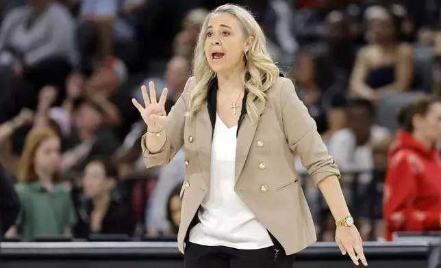 Las Vegas Aces head coach Becky Hammon calls to players during the first half of a WNBA basketball game against the Washington Mystics, Friday, May 23, 2025, in Las Vegas. (Steve Marcus/Las Vegas Sun via AP)