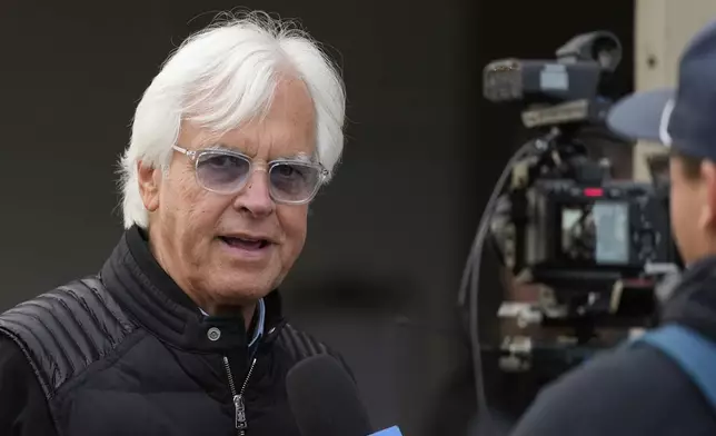 Trainer Bob Baffert does an interview outside his barn at Churchill Downs Monday, April 28, 2025, in Louisville, Ky. (AP Photo/Charlie Riedel)