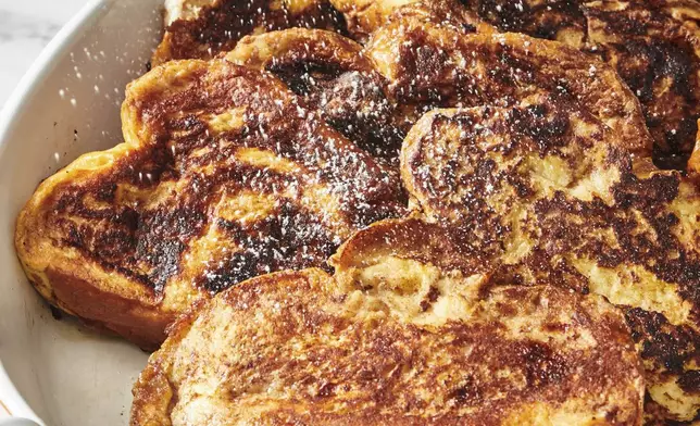 Slices of French toast are displayed in a dish in New York. (Cheyenne Cohen via AP)