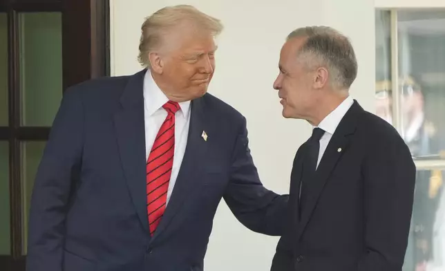 Canadian Prime Minister Mark Carney is greeted by President Donald Trump as he arrives at the West Wing of the White House, Tuesday, May 6, 2025, in Washington. (AP Photo/Mark Schiefelbein)