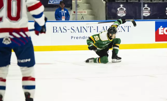London Knights' Landon Sim (90) celebrates after scoring against the London Knights during first-period semifinal Memorial Cup hockey action in Rimouski, Quebec, Friday, May 30, 2025. (Christopher Katsarov/The Canadian Press via AP)