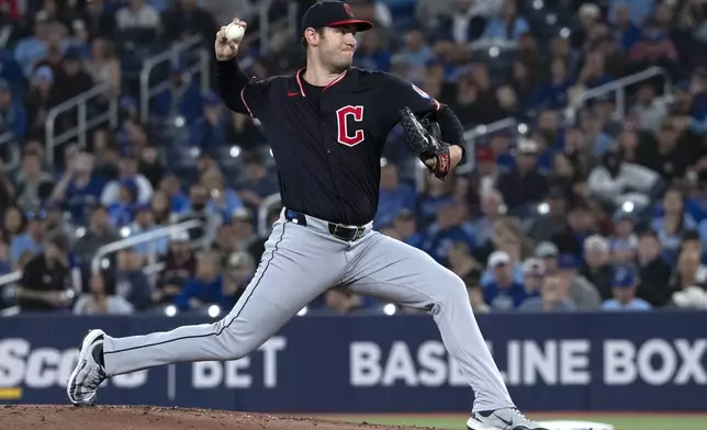 Cleveland Guardians starting pitcher Gavin Williams (32) throws to a Toronto Blue Jays batter during the first inning of a baseball game in Toronto, Saturday, May 3, 2025. (Jon Blacker/The Canadian Press via AP)