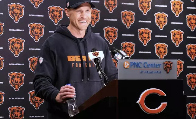Chicago Bears new head coach Ben Johnson smiles as he talks to media members after the NFL football team's rookie camp in Lake Forest, Ill., Friday, May 9, 2025. (AP Photo/Nam Y. Huh)
