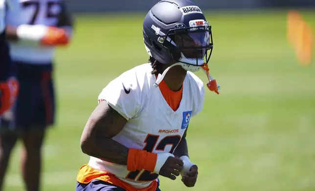 Denver Broncos cornerback Jahdae Barron takes part in drills during the NFL football team's rookie minicamp at the Broncos' headquarters Saturday, May 10, 2025, in Centennial, Colo. (AP Photo/David Zalubowski)