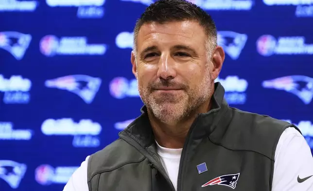 New England Patriots head coach Mike Vrabel smiles during a media availability prior to the NFL football team's rookie minicamp, Friday, May 9, 2025, in Foxborough, Mass. (AP Photo/Charles Krupa)