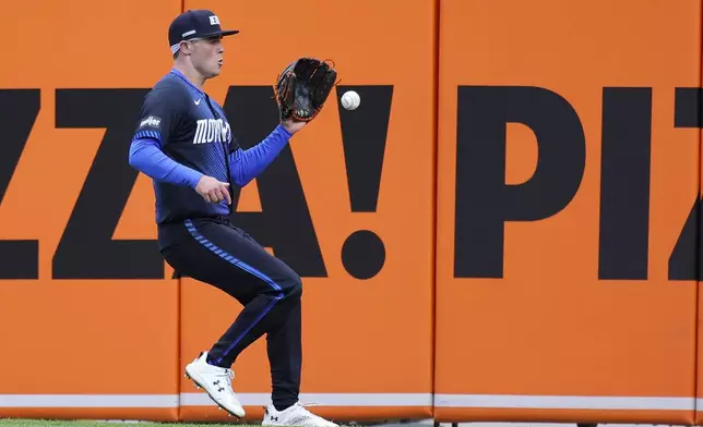 Detroit Tigers right fielder Kerry Carpenter chases down a double hit by Cleveland Guardians' Steven Kwan during the first inning of a baseball game Friday, May 23, 2025, in Detroit. (AP Photo/Duane Burleson)
