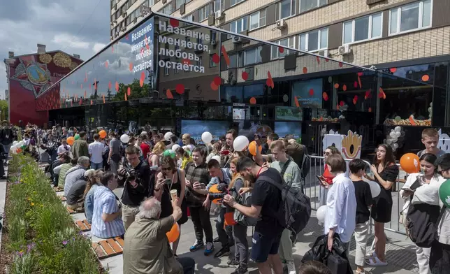 FILE - People line up to visit a newly opened fast food restaurant in a former McDonald's outlet in Bolshaya Bronnaya Street in Moscow, Russia, Sunday, June 12, 2022. The sign reads "The Name Changes, Love Remains." (AP Photo/Dmitry Serebryakov, File)
