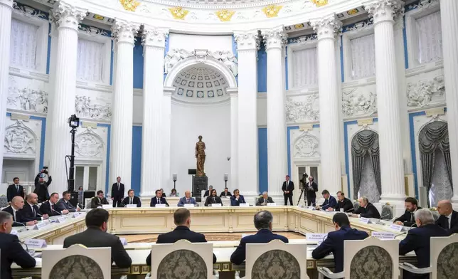 FILE - Russian President Vladimir Putin, fourth right, speaks during a meeting with members of Russia's business community at the Kremlin in Moscow, Russia, Monday, May 26, 2025. (Grigory Sysoyev, Sputnik, Kremlin Pool Photo via AP, File)