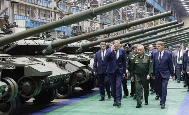 FILE - In this photo released by the Russian Defense Ministry Press Service on Friday, April 19, 2024, Russian Defense Minister Sergei Shoigu, second right, visits a factory workshop as he checks the implementation of the state defense order at an enterprise of the military-industrial complex in the Omsk region of Russia, which produces tanks and heavy flamethrower systems. (Russian Defense Ministry Press Service via AP, File)