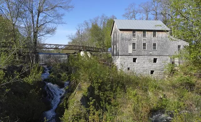 Water flows beneath a dam, Tuesday, May 13, 2025, in Freedom, Maine. (AP Photo/Robert F. Bukaty)