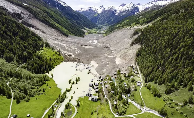 An aerial view shows the destruction of Blatten, Switzerland, Thursday, May 29, 2025, one day after a massive debris avalanche, triggered by the collapse of the Birch Glacier, swept down to the valley floor and demolished large parts of the village. (Jean-Christophe Bott/Keystone via AP)