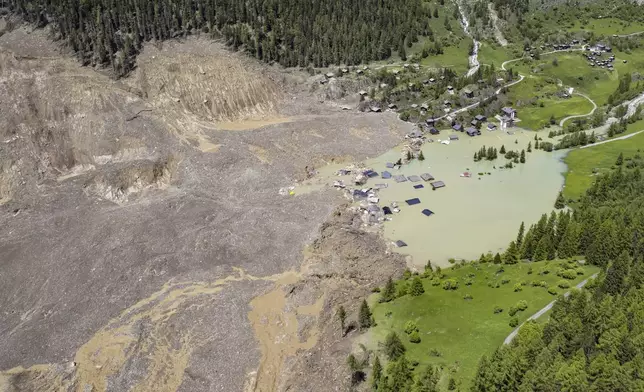 An aerial view shows the destruction of Blatten, Switzerland, Thursday, May 29, 2025, one day after a massive debris avalanche, triggered by the collapse of the Birch Glacier, swept down to the valley floor and demolished large parts of the village. (Jean-Christophe Bott/Keystone via AP)