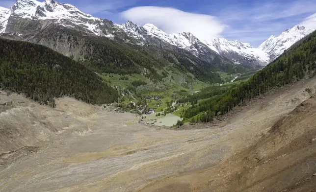 An aerial view shows the destruction of Blatten, Switzerland, Thursday, May 29, 2025, one day after a massive debris avalanche, triggered by the collapse of the Birch Glacier, swept down to the valley floor and demolished large parts of the village. (Jean-Christophe Bott/Keystone via AP)
