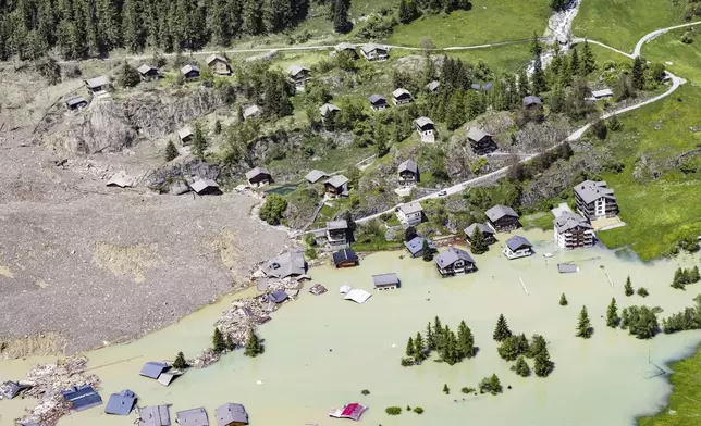 An aerial view shows the destruction of Blatten, Switzerland, Thursday, May 29, 2025, one day after a massive debris avalanche, triggered by the collapse of the Birch Glacier, swept down to the valley floor and demolished large parts of the village. (Jean-Christophe Bott/Keystone via AP)