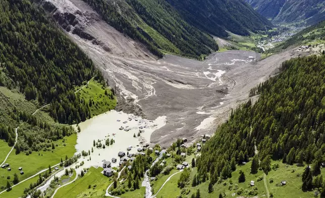 An aerial view shows the destruction of Blatten, Switzerland, Thursday, May 29, 2025, one day after a massive debris avalanche, triggered by the collapse of the Birch Glacier, swept down to the valley floor and demolished large parts of the village. (Jean-Christophe Bott/Keystone via AP)