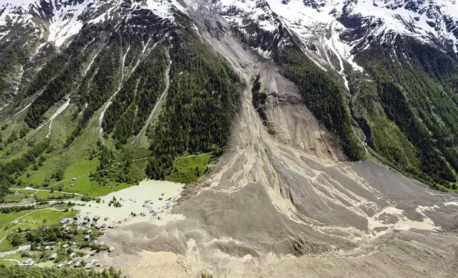 An aerial view shows the destruction of Blatten, Switzerland, Thursday, May 29, 2025, one day after a massive debris avalanche, triggered by the collapse of the Birch Glacier, swept down to the valley floor and demolished large parts of the village. (Jean-Christophe Bott/Keystone via AP)