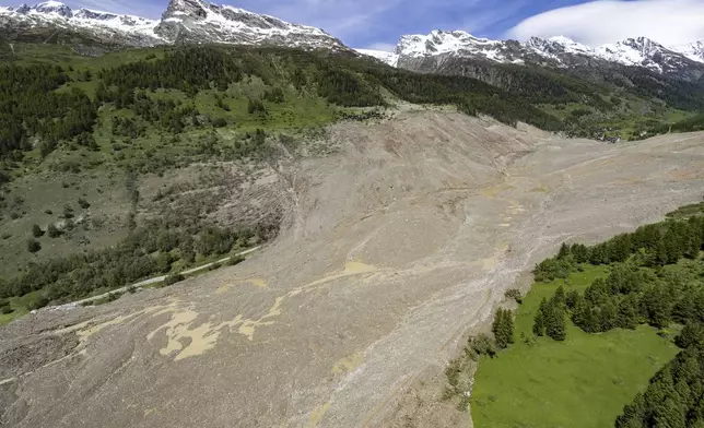 An aerial view shows the destruction of Blatten, Switzerland, Thursday, May 29, 2025, one day after a massive debris avalanche, triggered by the collapse of the Birch Glacier, swept down to the valley floor and demolished large parts of the village. (Jean-Christophe Bott/Keystone via AP)
