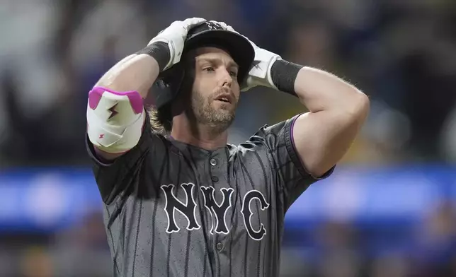 New York Mets' Jeff McNeil reacts after hitting a foul ball during the ninth inning of a baseball game against the Chicago Cubs Saturday, May 10, 2025, in New York. (AP Photo/Frank Franklin II)