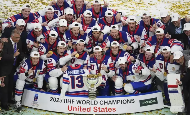 Team USA poses after winning the final match between United States and Switzerland at the ice hockey world championships in Stockholm, Sweden, Sunday, May 25, 2025. (AP Photo/Petr David Josek)