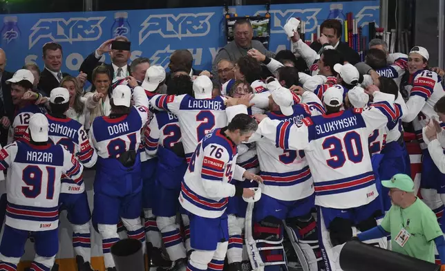 Team USA celebrates after winning the final match between United States and Switzerland at the ice hockey world championships in Stockholm, Sweden, Sunday, May 25, 2025. (AP Photo/Petr David Josek)