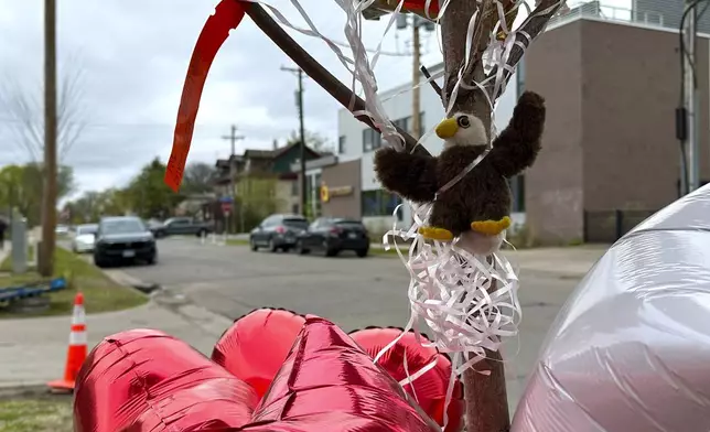 Items are placed as a memorial at the site of a late Tuesday fatal shooting, on Friday, May 2, 2025 in Minneapolis. (AP Photo/Mark Vancleave)