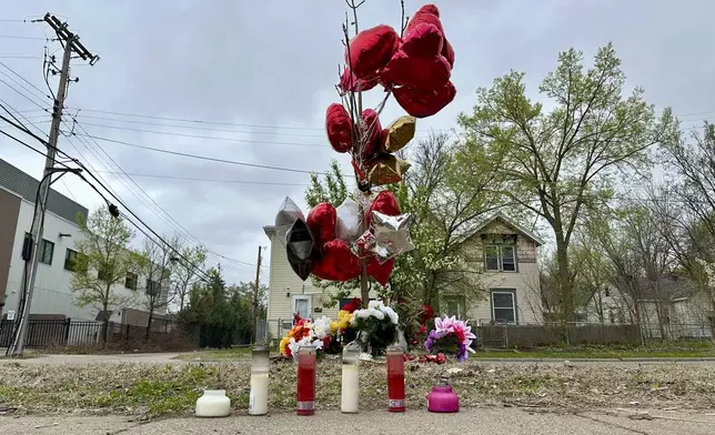 Items are placed as a memorial at the site of a late Tuesday fatal shooting, on Friday, May 2, 2025 in Minneapolis. (AP Photo/Mark Vancleave)