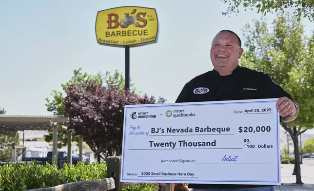 Jay Rathmann of BJ's Nevada BBQ is honored as Intuit QuickBooks and Mailchimp Small Business Hero with a $20,000 check on Thursday, May 8, 2025 in Sparks, Nev. (Bridget Bennett/AP Content Services for Intuit QuickBooks)