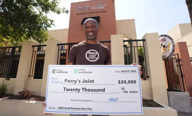 Perry Bennett of Perry's Joint in Pasadena, Calif., is honored as Intuit QuickBooks and Mailchimp Small Business Hero with a $20,000 check on Monday, April 28, 2025. (Jordan Strauss/AP Content Services for Intuit QuickBooks)