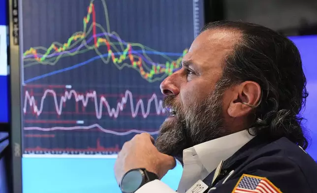 Specialist Michael Pistillo works at his post on the floor of the New York Stock Exchange, Monday, May 12, 2025. (AP Photo/Richard Drew)