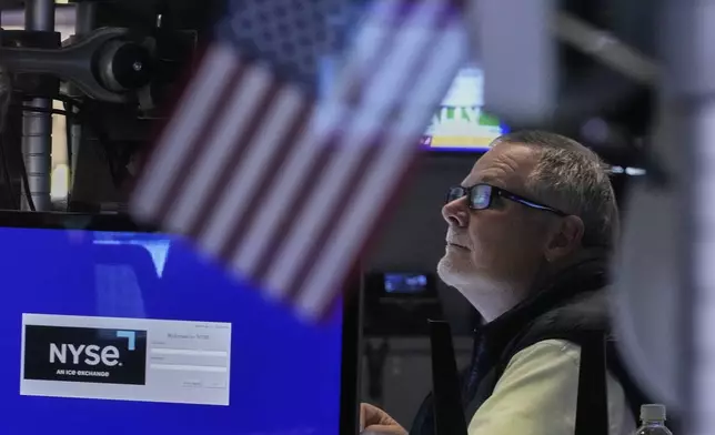 Trader Michael Conlon works on the floor of the New York Stock Exchange, Monday, May 12, 2025. (AP Photo/Richard Drew)